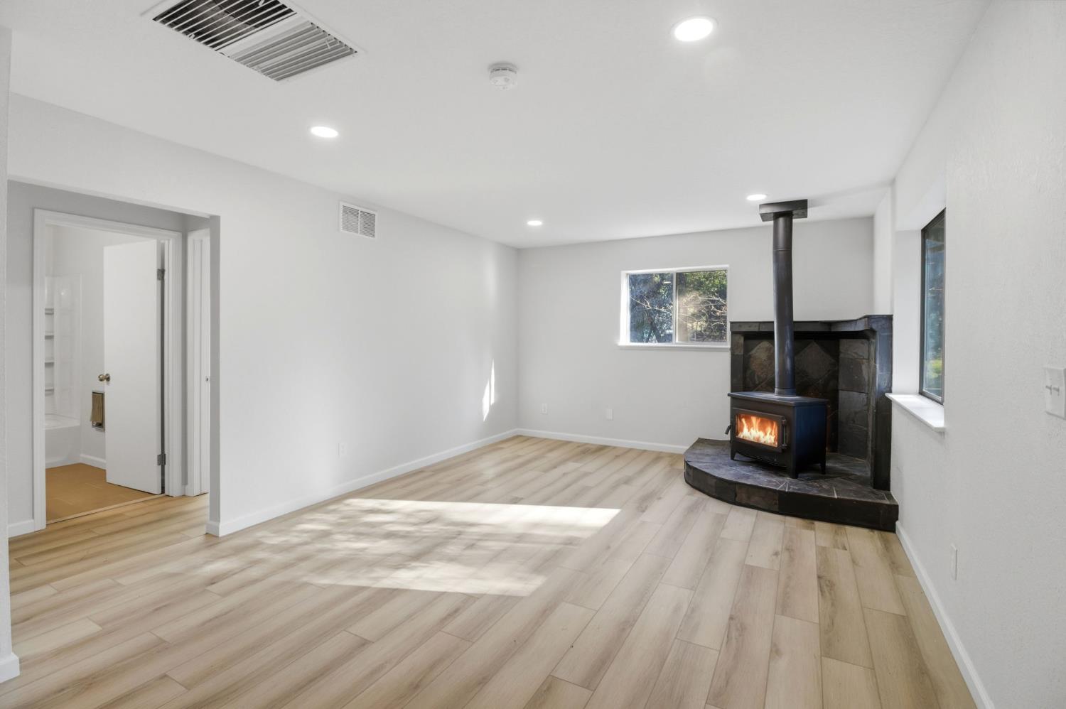 19088 Hillhaven Road Tuolumne, CA 95379 - Photo 6 of 27 a bedroom with a bed and a wooden floor