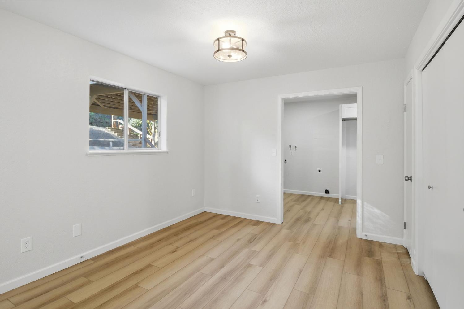 19088 Hillhaven Road Tuolumne, CA 95379 - Photo 8 of 27 a view of a room with wooden floor and window