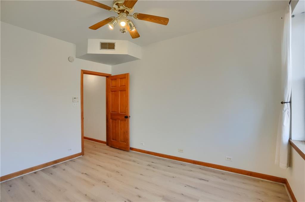 2810 Sarah Street, Unit 2 Pittsburgh, PA 15203 - Photo 15 of 27 a view of an empty room with window and wooden floor