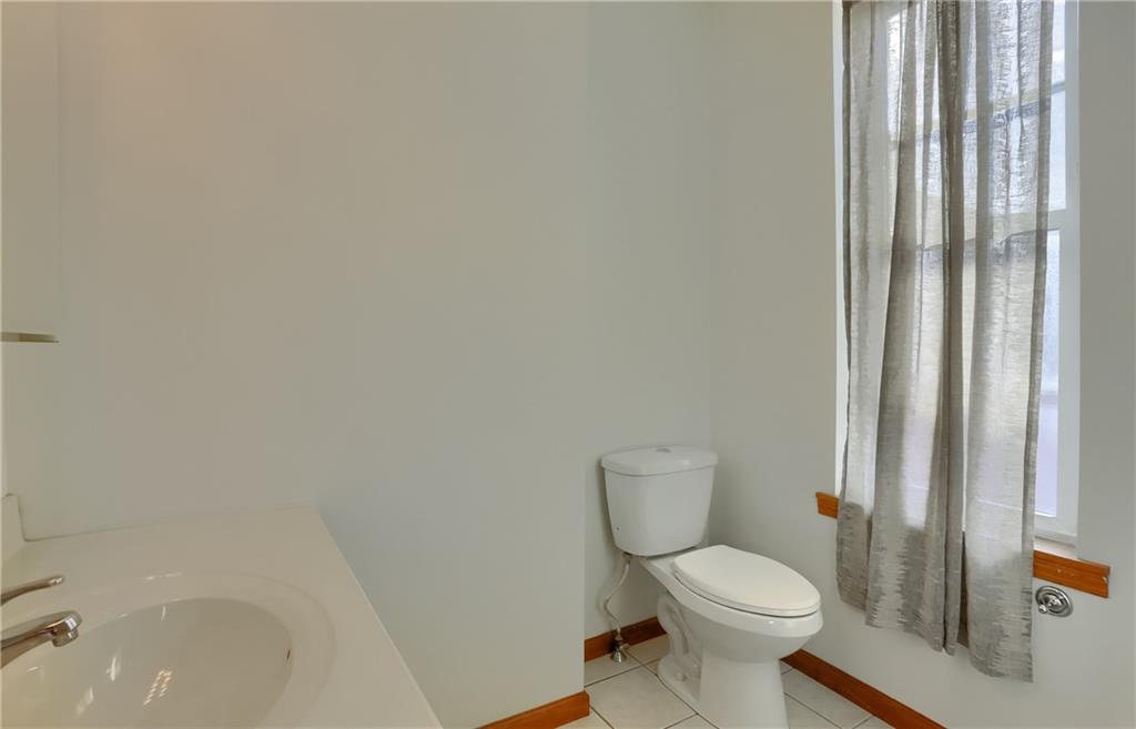 2810 Sarah Street, Unit 2 Pittsburgh, PA 15203 - Photo 19 of 27 a white toilet sitting next to a bath tub