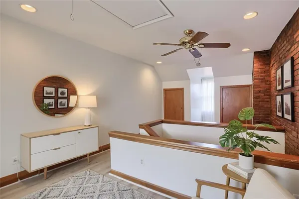 a view of lobby with a ceiling fan