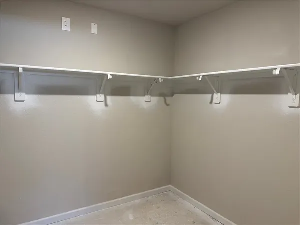 a view of a room with racks on the wall