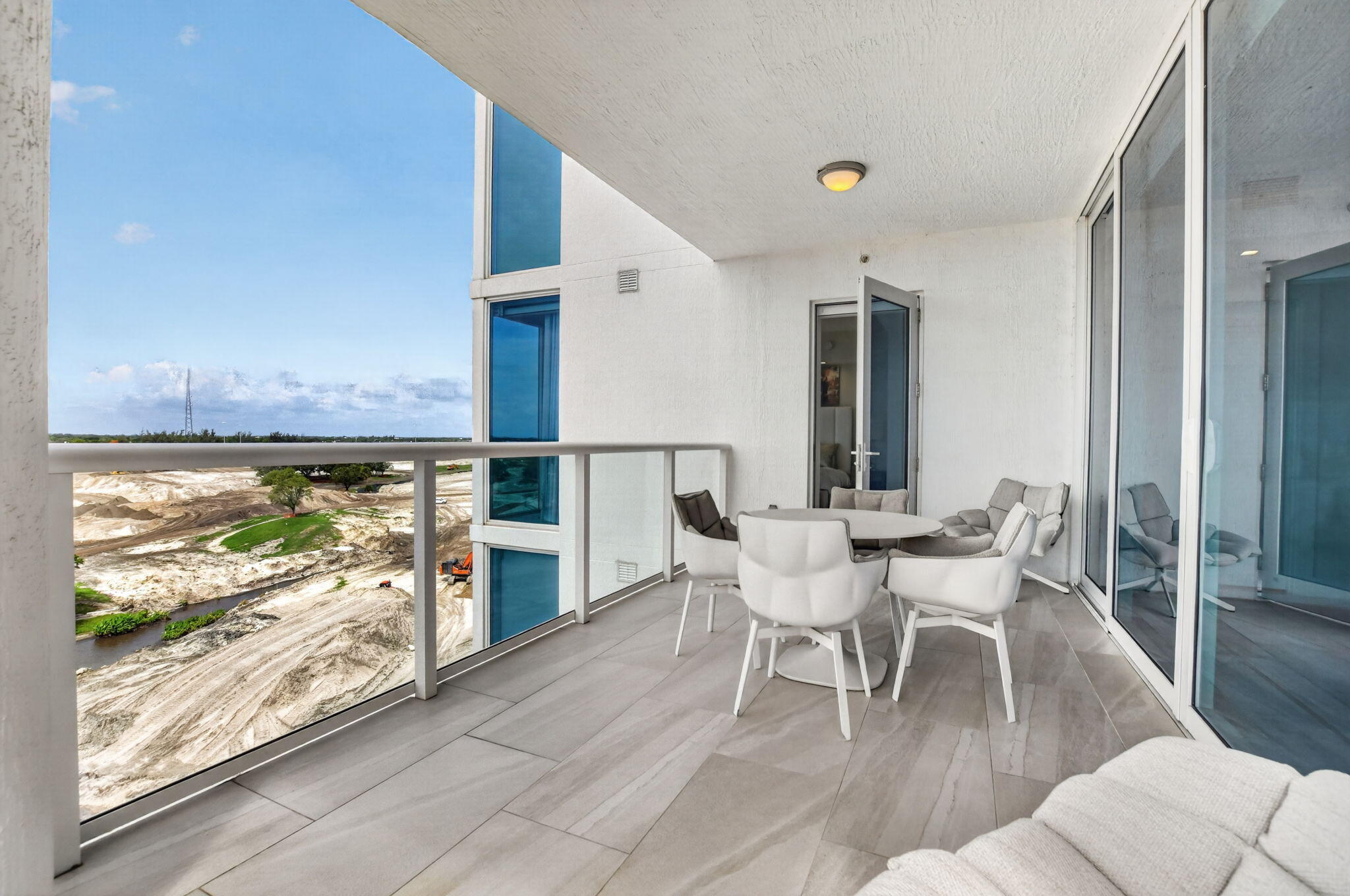 20155 Boca W Drive, Unit B701 Boca Raton, FL 33434 - Photo 43 of 78 a dining room with furniture and wooden floor