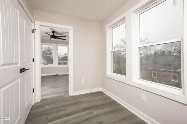a view of an empty room with a window