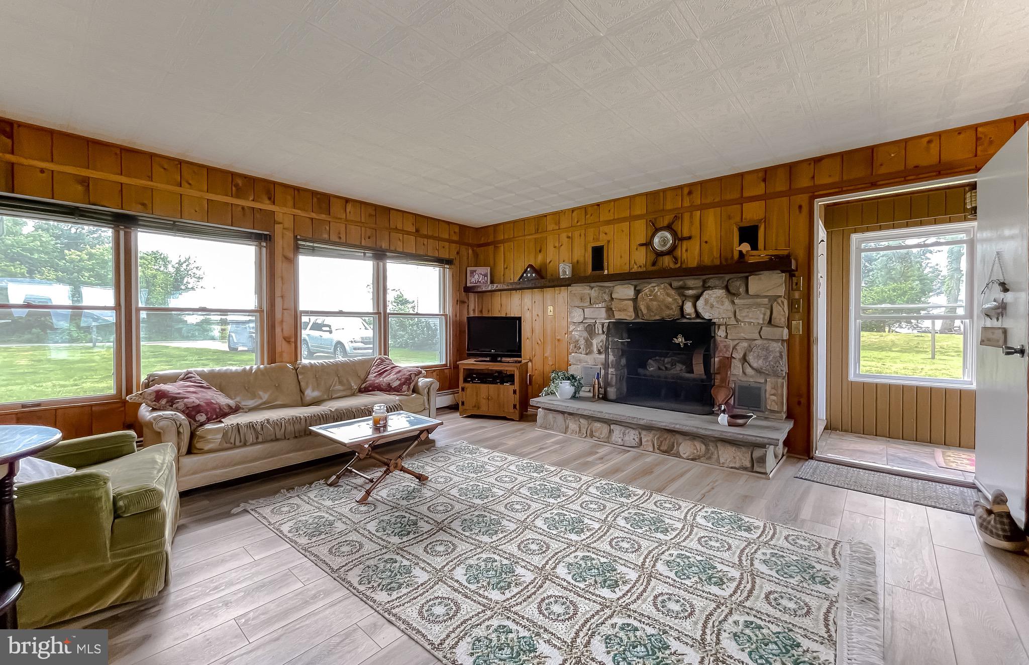 16721 St Jeromes Neck Road Dameron, MD 20628 - Photo 73 of 133 Large family room with wood burning fireplace