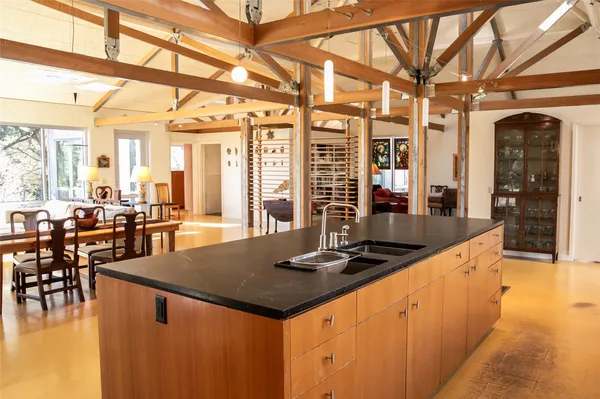 a dining room with furniture and wooden floor