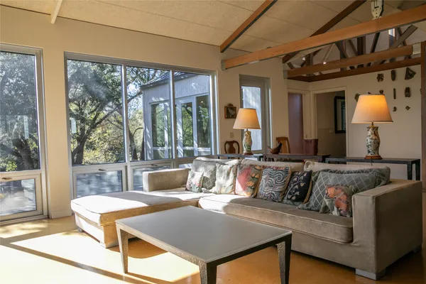 a livingroom with furniture and a large window