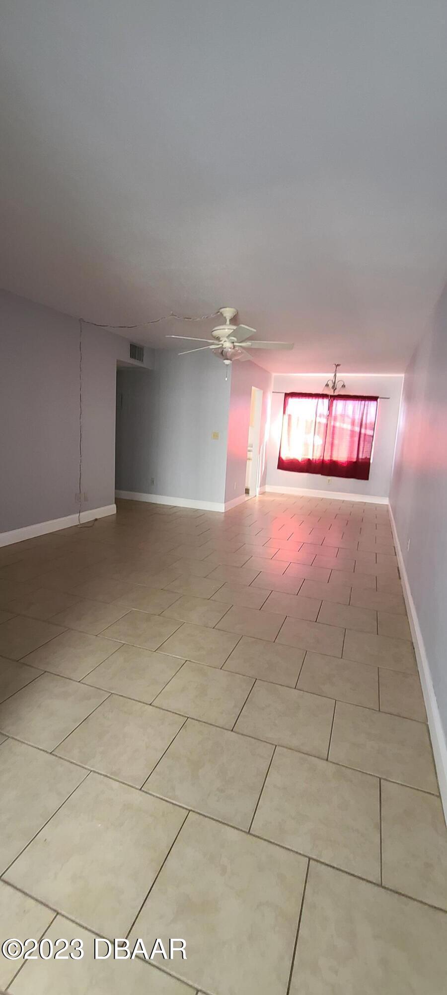 301 Ridge Boulevard, Unit 1020 South Daytona, FL 32119 - Photo 4 of 12 a view of an empty room and window