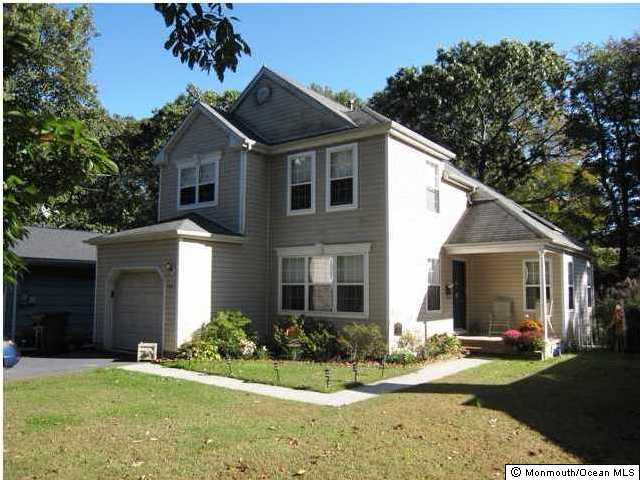 615 Thoroughfare Road Brick, NJ 08724 - Photo 1 of 3 a front view of a house with a yard