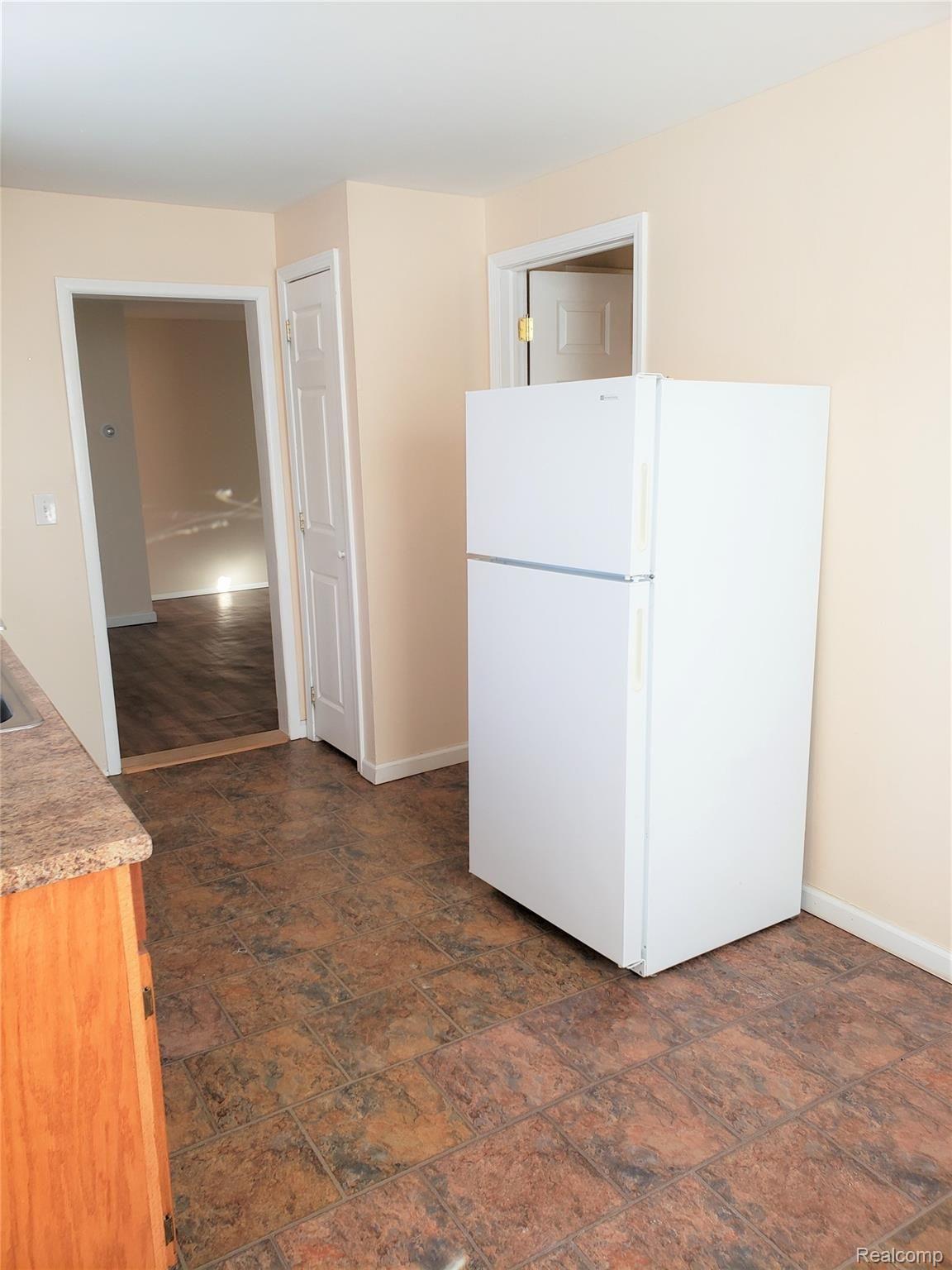 3501 Thomas Road Oxford, MI 48371 - Photo 17 of 26 Unit 3 kitchen refrigerator into living room