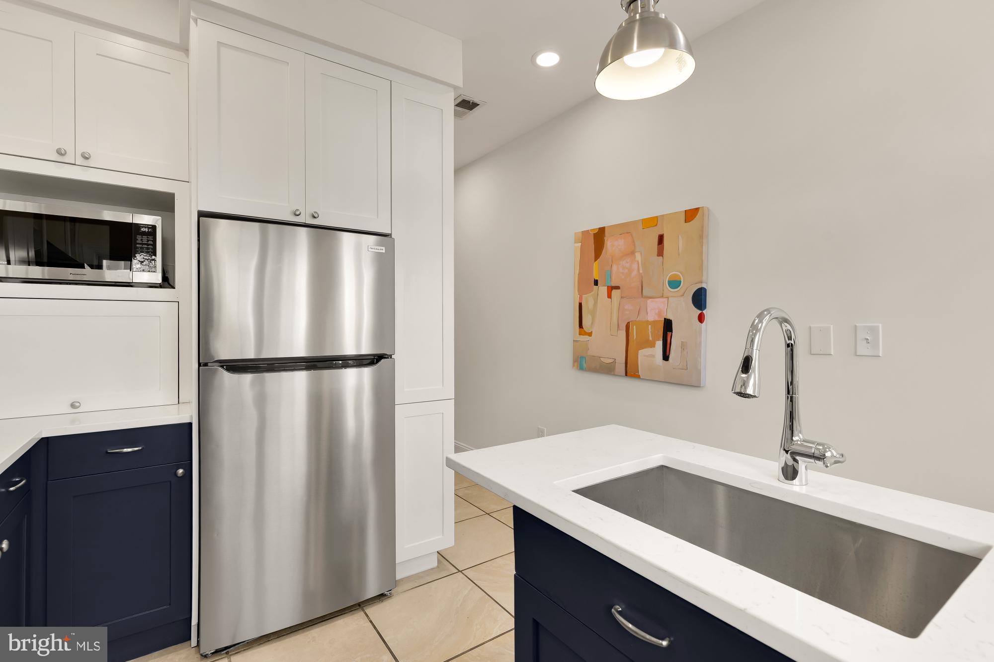 632 Acker Place Northeast Washington, DC 20002 - Photo 19 of 57 a kitchen with a refrigerator and a sink