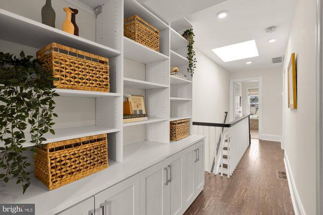a view of kitchen with cabinets and wooden floor