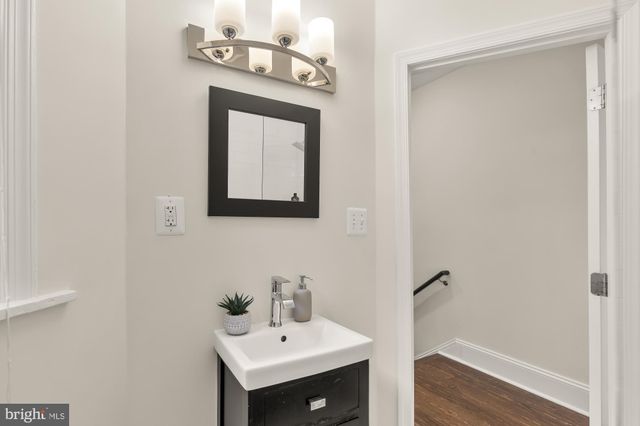 a living room with a rug and a table