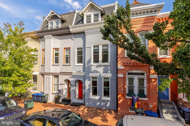 a view of a street with cars