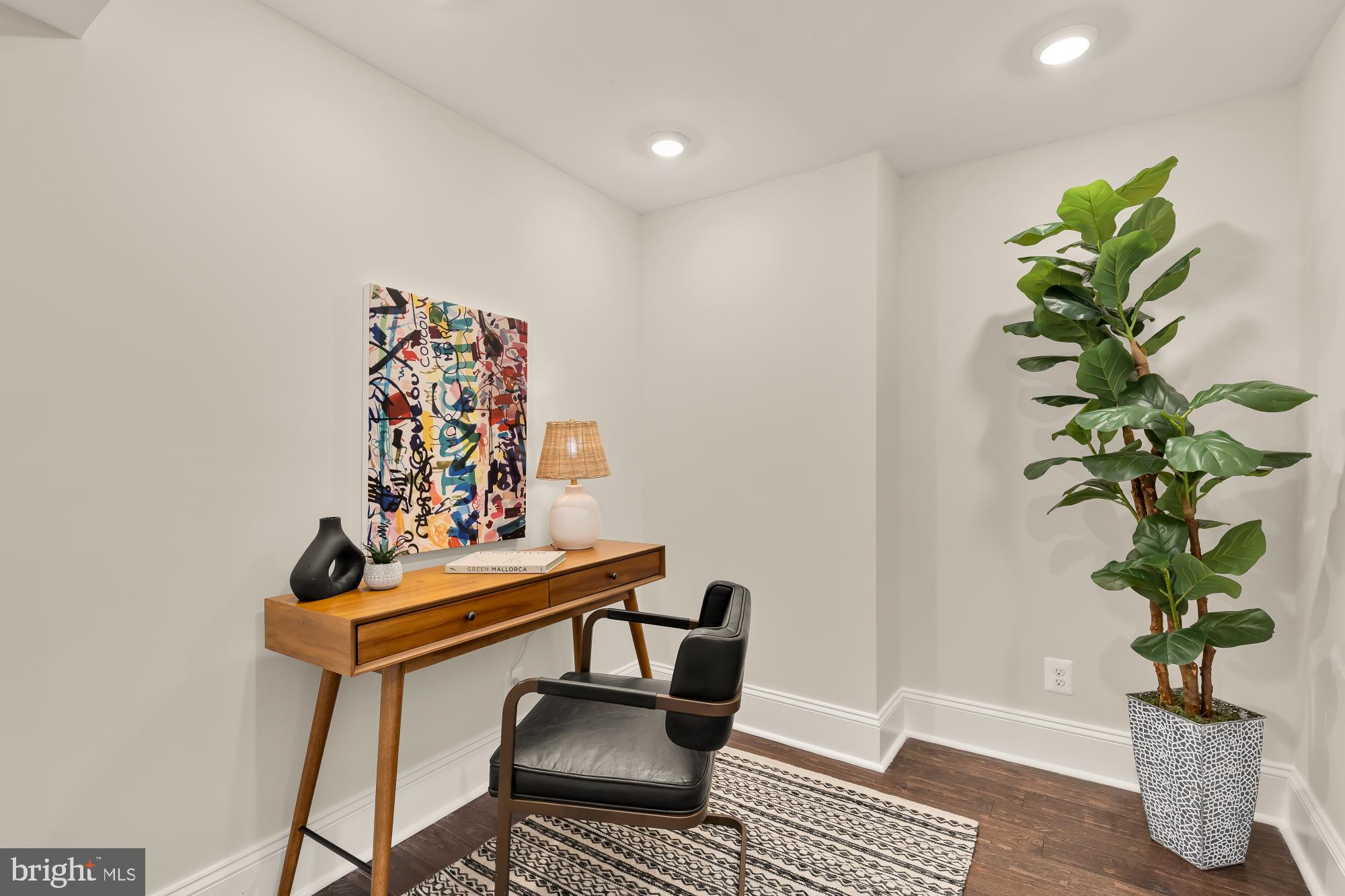632 Acker Place Northeast Washington, DC 20002 - Photo 31 of 57 a table room with furniture and a potted plant