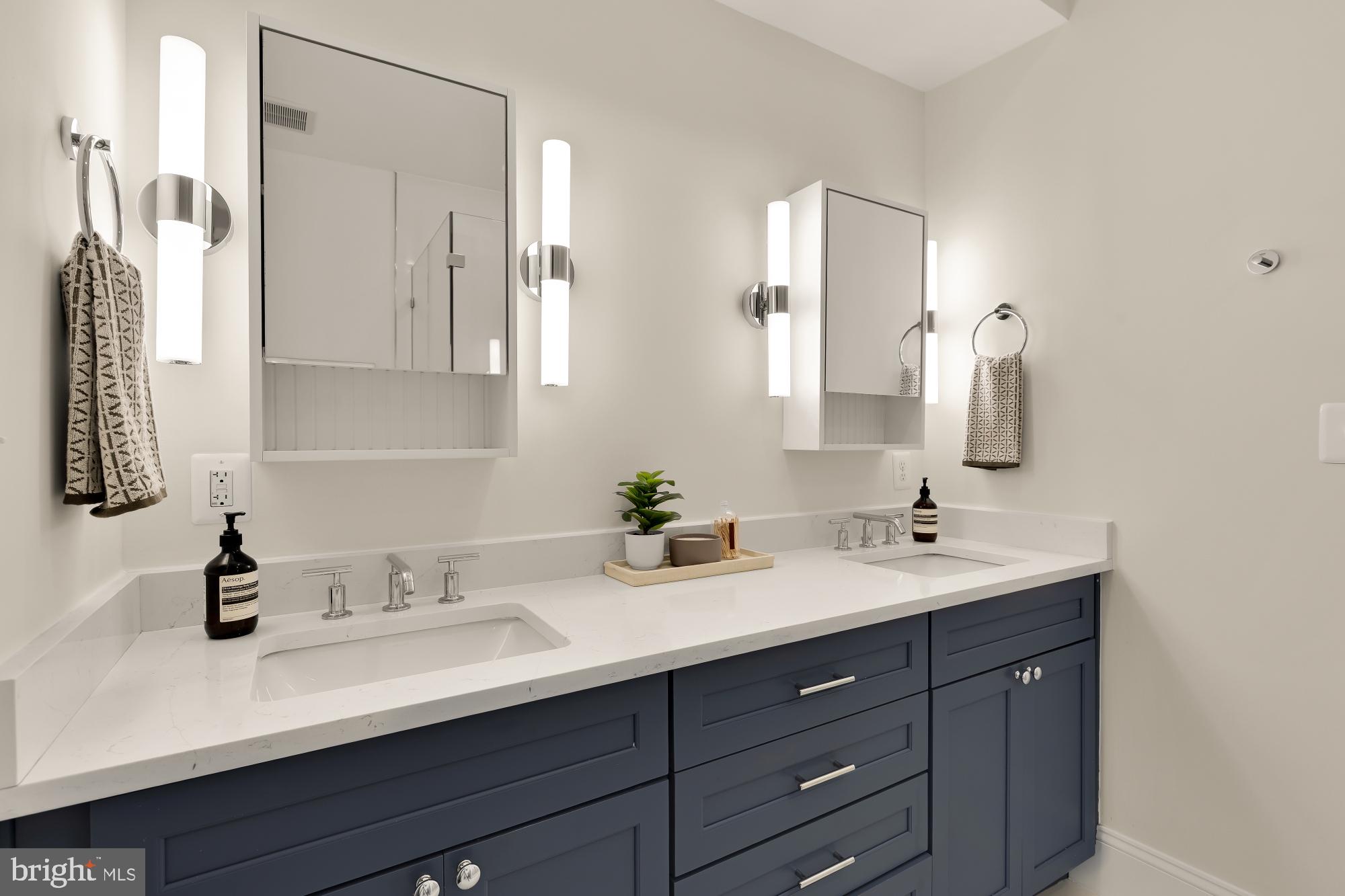 632 Acker Place Northeast Washington, DC 20002 - Photo 39 of 57 a bathroom with a double vanity sink and mirror