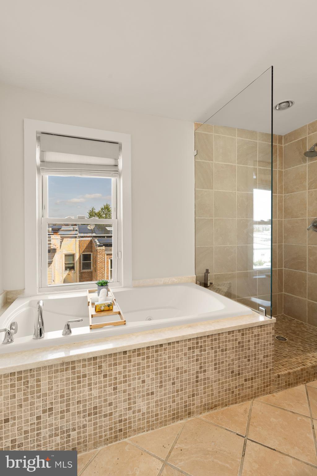 632 Acker Place Northeast Washington, DC 20002 - Photo 45 of 57 a bathroom with a bathtub and a shower