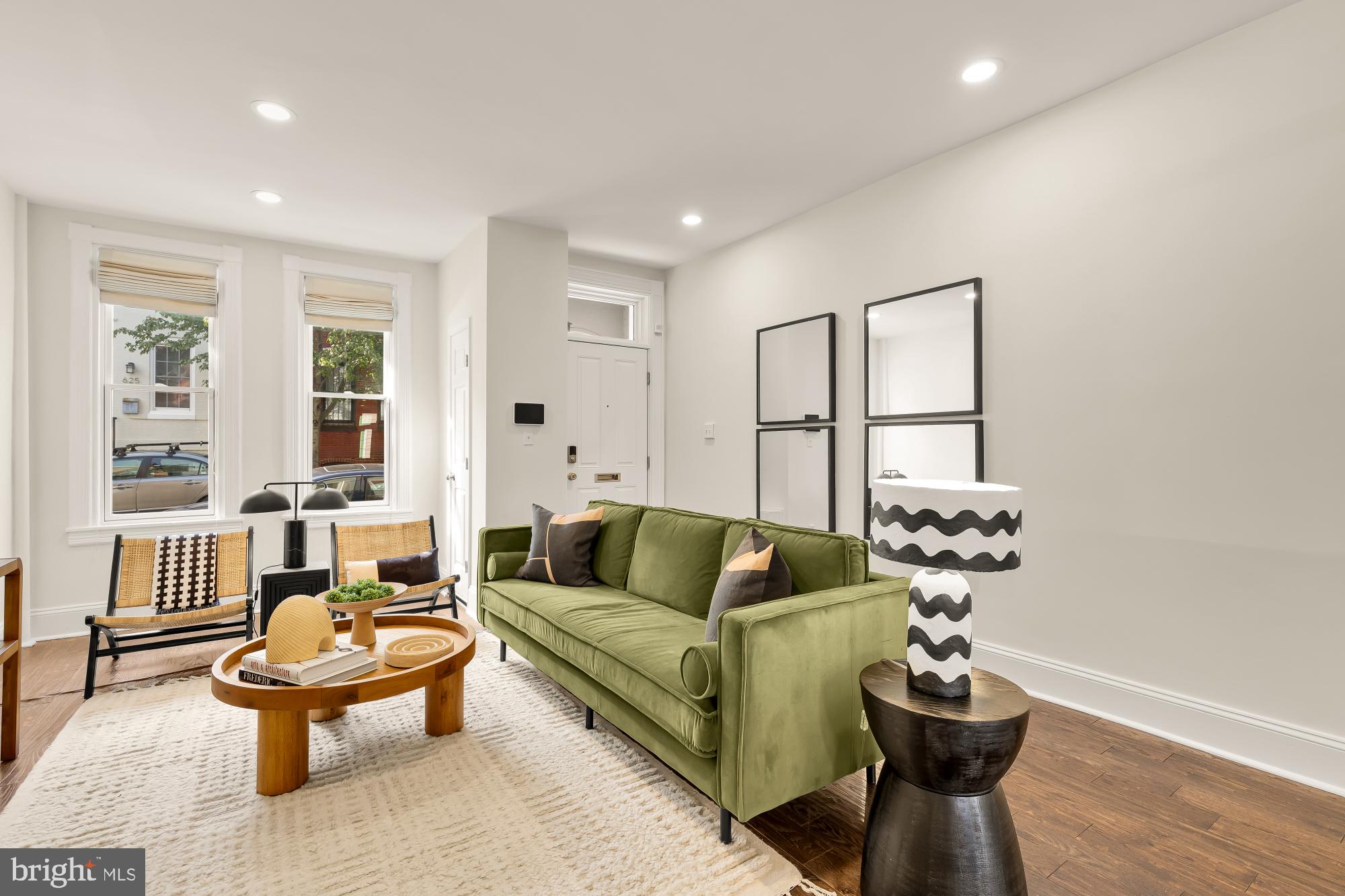 632 Acker Place Northeast Washington, DC 20002 - Photo 6 of 57 a living room with furniture and a large window