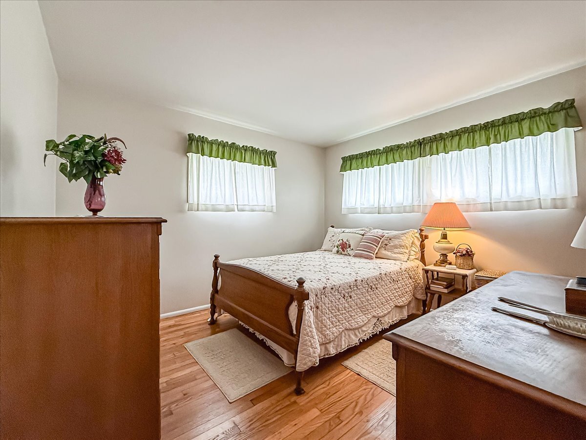 1612 Cornell Drive Champaign, IL 61821 - Photo 18 of 28 a bedroom with two beds and a window