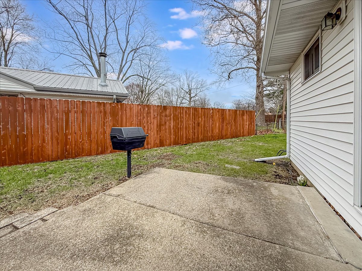 1612 Cornell Drive Champaign, IL 61821 - Photo 23 of 28 a backyard of a house with table and chairs