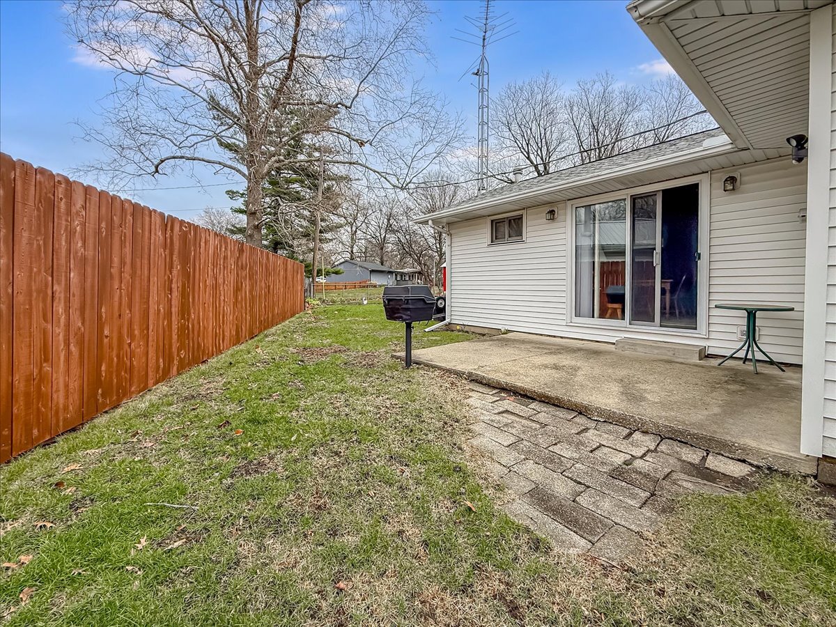 1612 Cornell Drive Champaign, IL 61821 - Photo 24 of 28 a view of a backyard with a tree