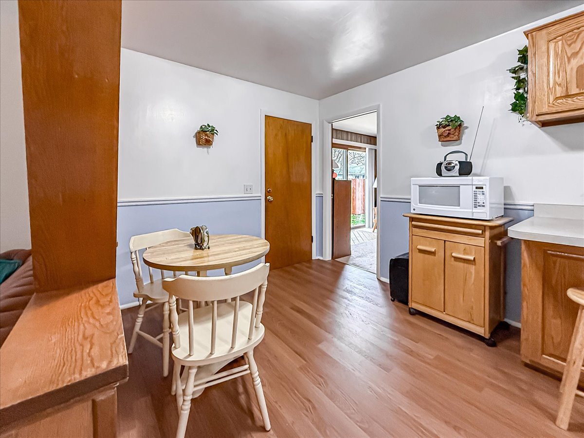 1612 Cornell Drive Champaign, IL 61821 - Photo 6 of 28 a kitchen with a table chairs and wooden floor
