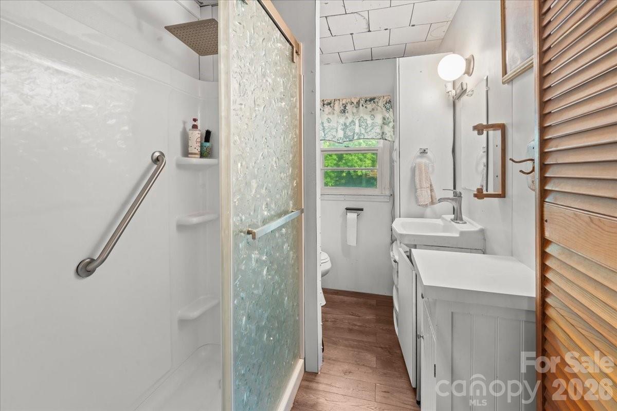 12282 Coyle Road Stanfield, NC 28163 - Photo 11 of 24 a bathroom with a sink a toilet and shower