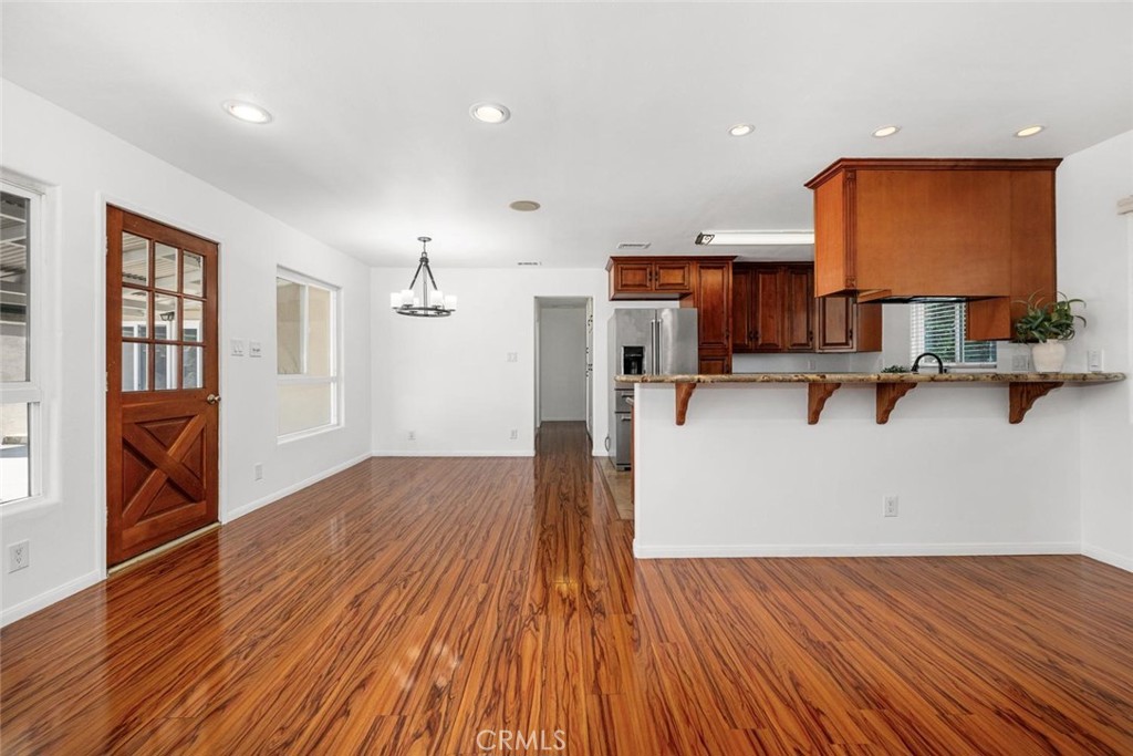 1238 North Studebaker Road Long Beach, CA 90815 - Photo 10 of 47 a view of a kitchen with wooden floor and a sink