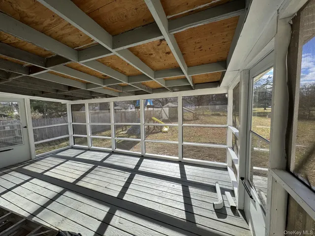 a view of balcony with wooden floor