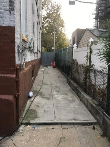 a view of backyard with furniture and a window
