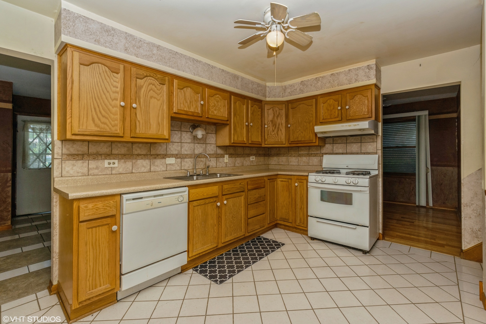 18017 Ravisloe Terrace Country Club Hills, IL 60478 - Photo 3 of 10 a kitchen with a stove sink and cabinets