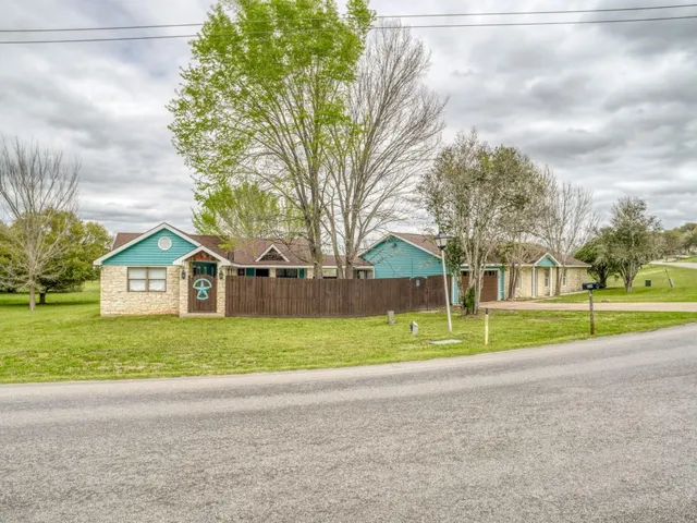 a view of road and trees in the background