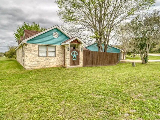 a front view of a house with yard