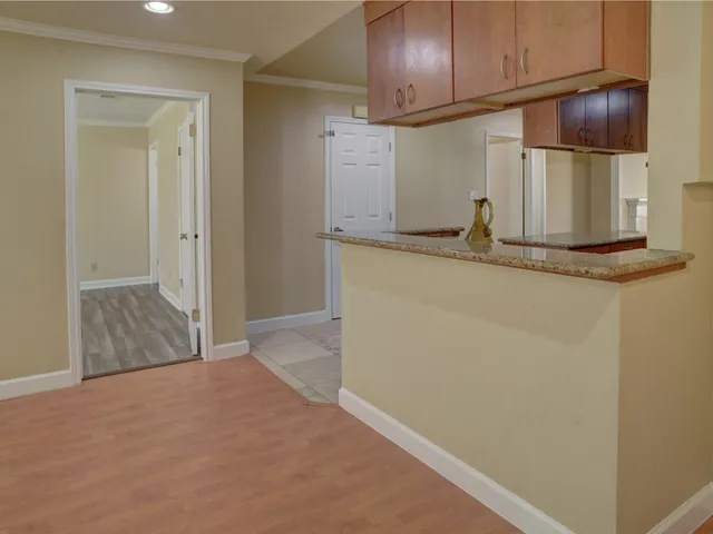a view of a kitchen with wooden floor