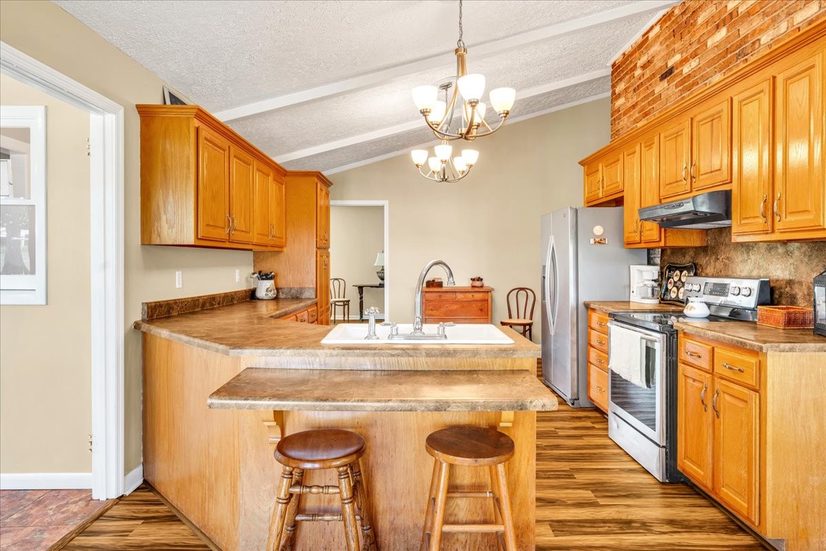 183 Prairie Plains Road Hillsboro, TN 37342 - Photo 11 of 63 a kitchen with stainless steel appliances granite countertop a sink and cabinets