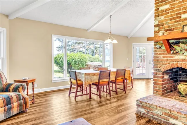a bathroom with a sink toilet a mirror and shower