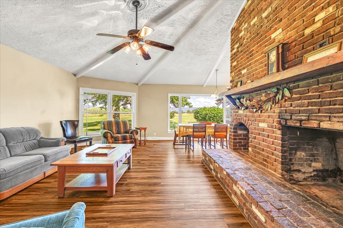 183 Prairie Plains Road Hillsboro, TN 37342 - Photo 18 of 63 a living room with furniture and a fireplace