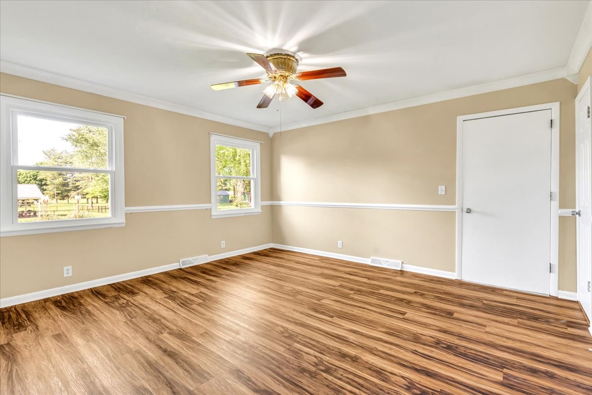 183 Prairie Plains Road Hillsboro, TN 37342 - Photo 22 of 63 a view of an empty room with wooden floor and a window