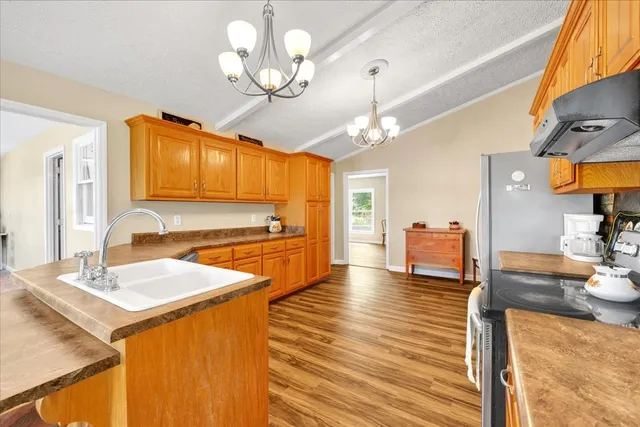 a front view of a house with a yard table and chairs