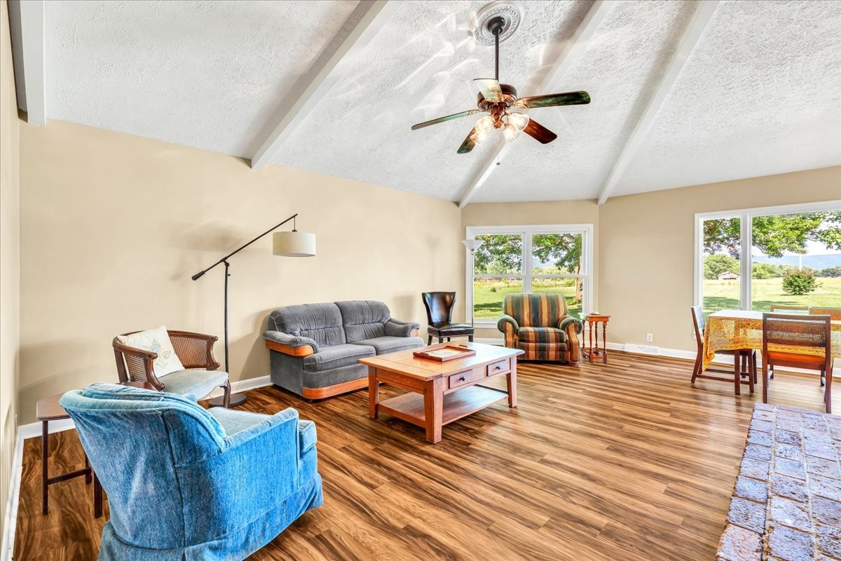 183 Prairie Plains Road Hillsboro, TN 37342 - Photo 37 of 63 a living room with fireplace furniture and a large window