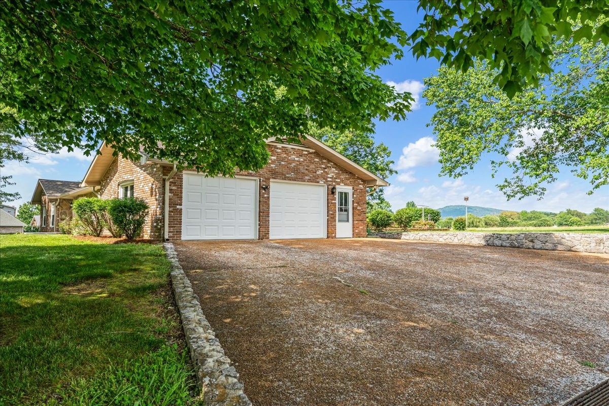 183 Prairie Plains Road Hillsboro, TN 37342 - Photo 4 of 63 a view of a house with backyard and garden