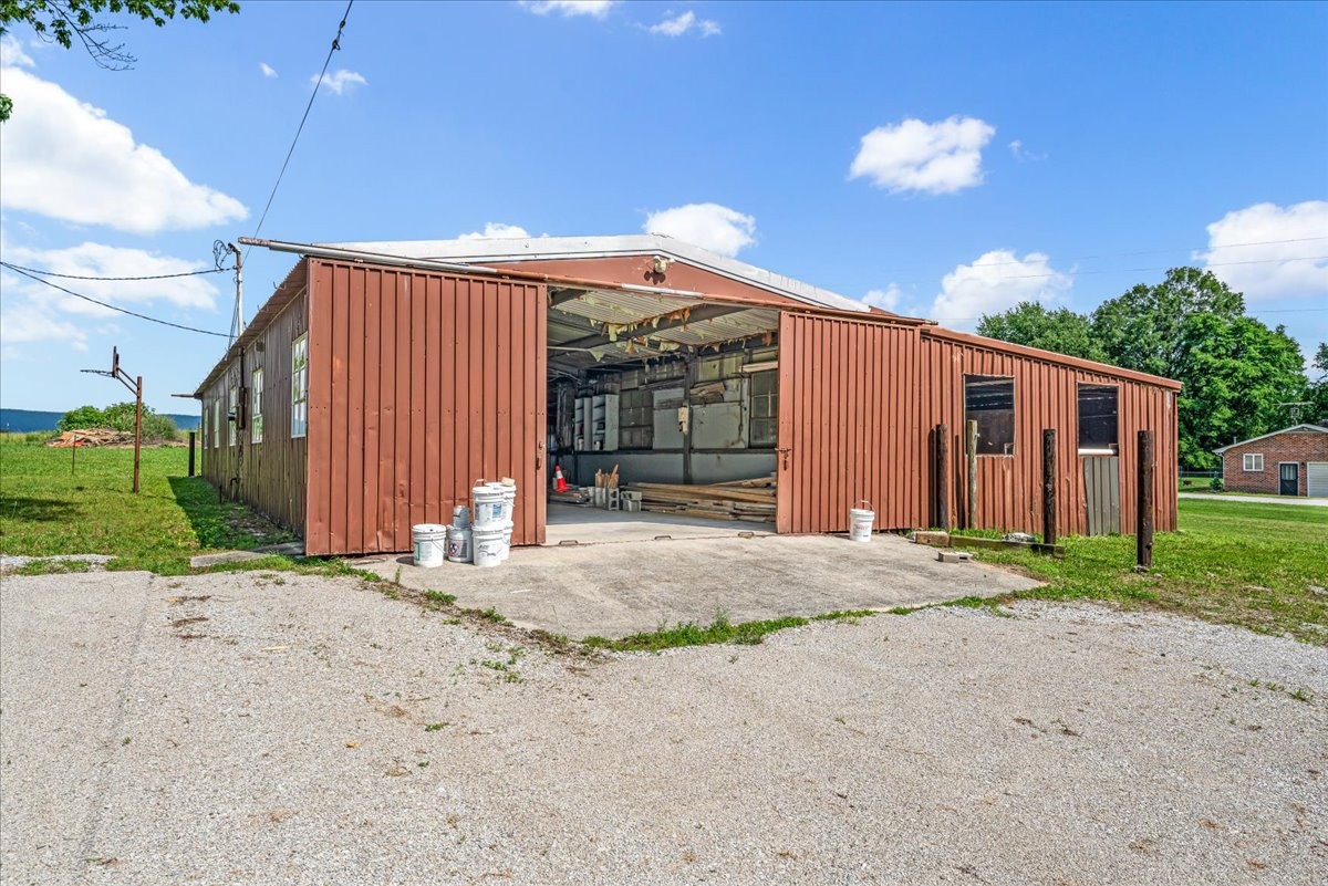 183 Prairie Plains Road Hillsboro, TN 37342 - Photo 41 of 63 a view of a house with backyard and trees