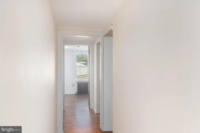 a view of a bathroom from a hallway