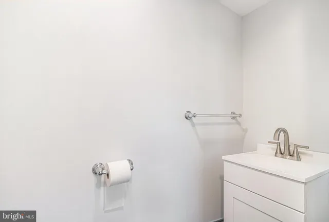 a bathroom with a sink and mirror