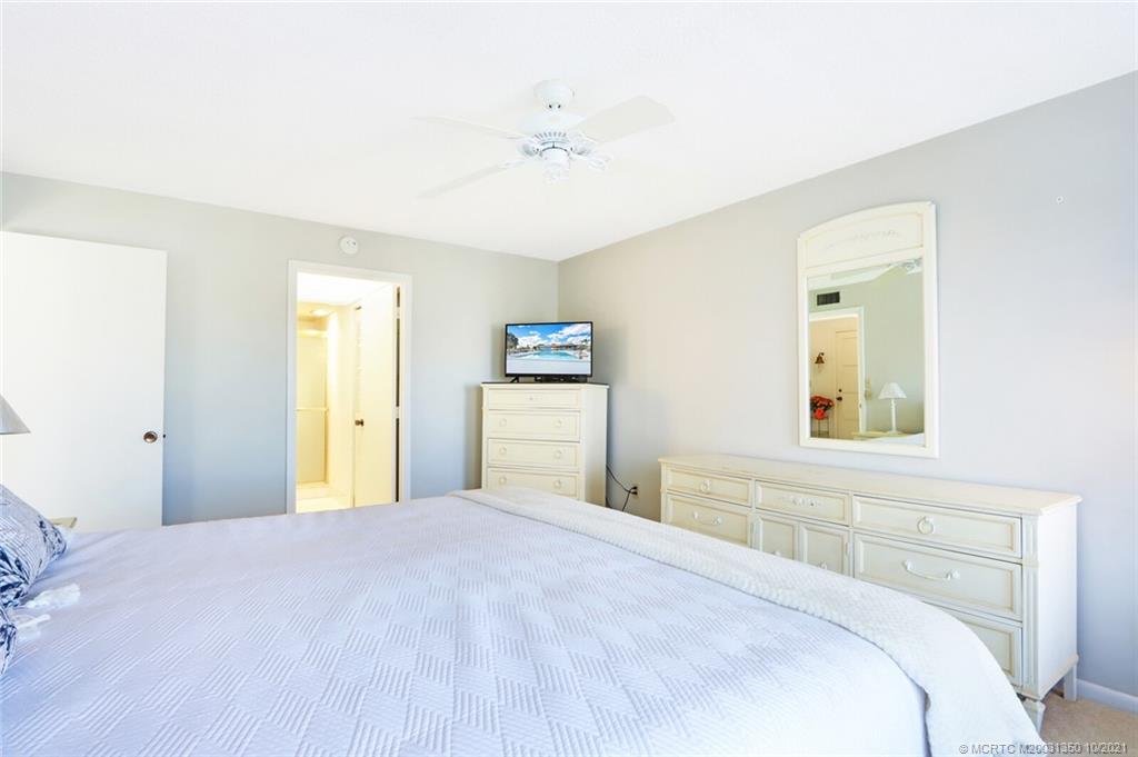 5443 Southeast Miles Grant Road, Unit D205 Stuart, FL 34997 - Photo 20 of 44 Owners Suite with bathroom and walk-in closets and linen storage