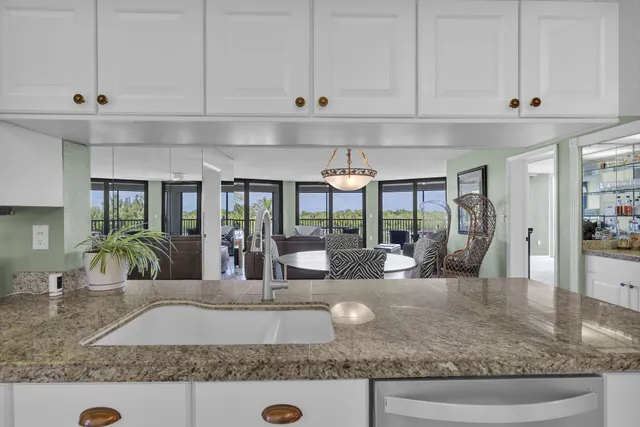 a kitchen with stainless steel appliances a refrigerator and a sink