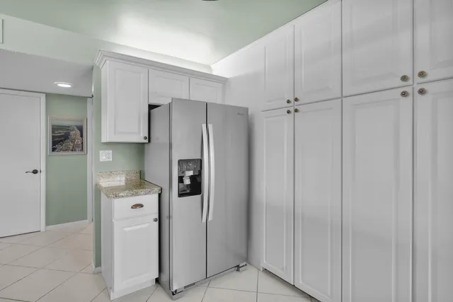 a living room with furniture and large windows