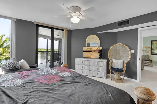 a bathroom with a granite countertop sink a mirror and a bathtub