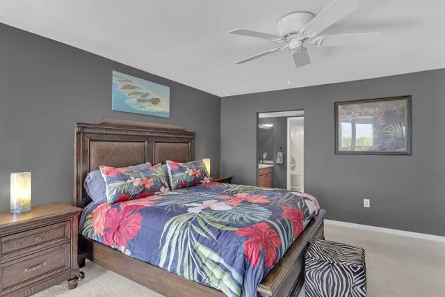 a bathroom with a granite countertop sink a mirror a vanity and shower