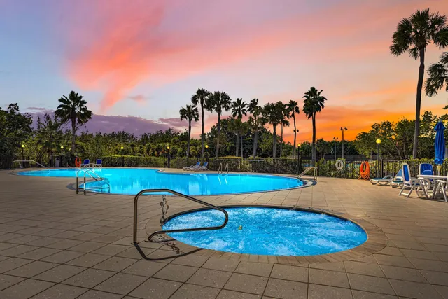 a view of a swimming pool with a yard